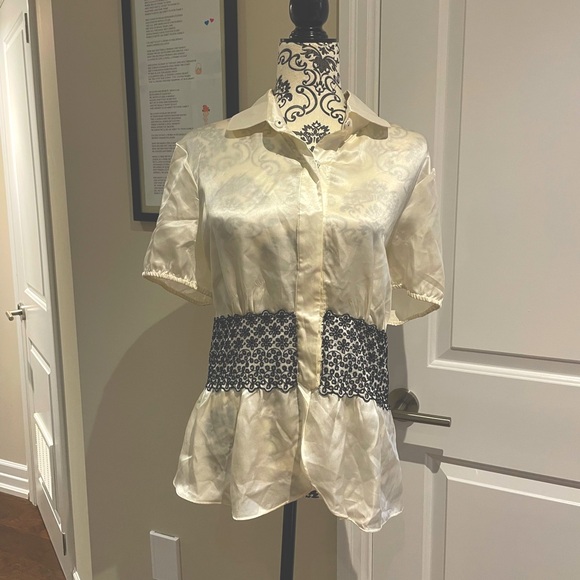 Beautiful silk blouse with black lace trim along the waist area. - Picture 2 of 10